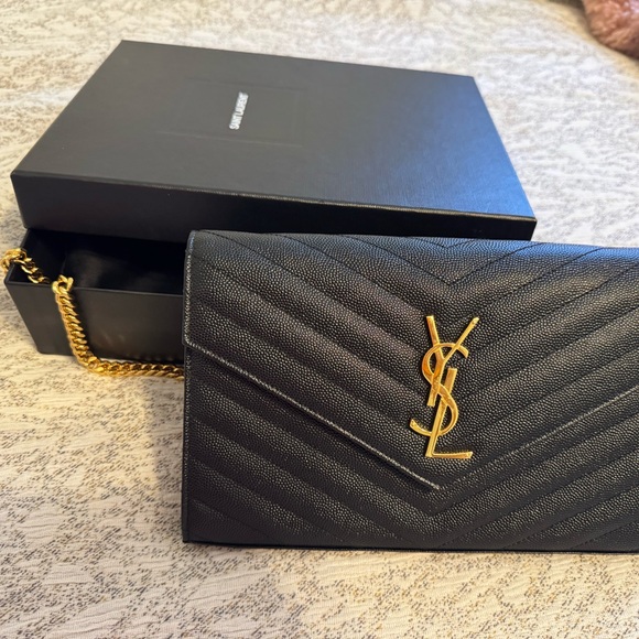 Yves Saint Laurent Handbags - Yves Saint Laurent Black Clutch with Gold Chain